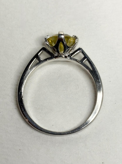 Sterling silver ring with a yellow moissanite solitaire stone.