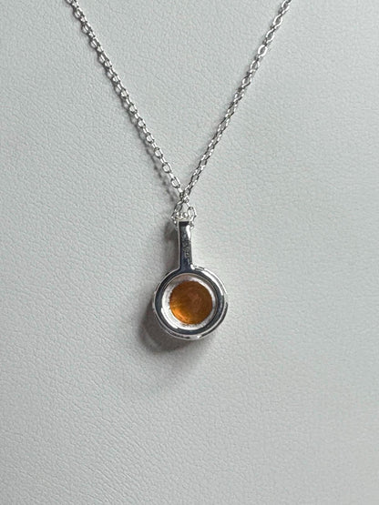 Sterling silver pendant necklace with a round Oregon fire opal.