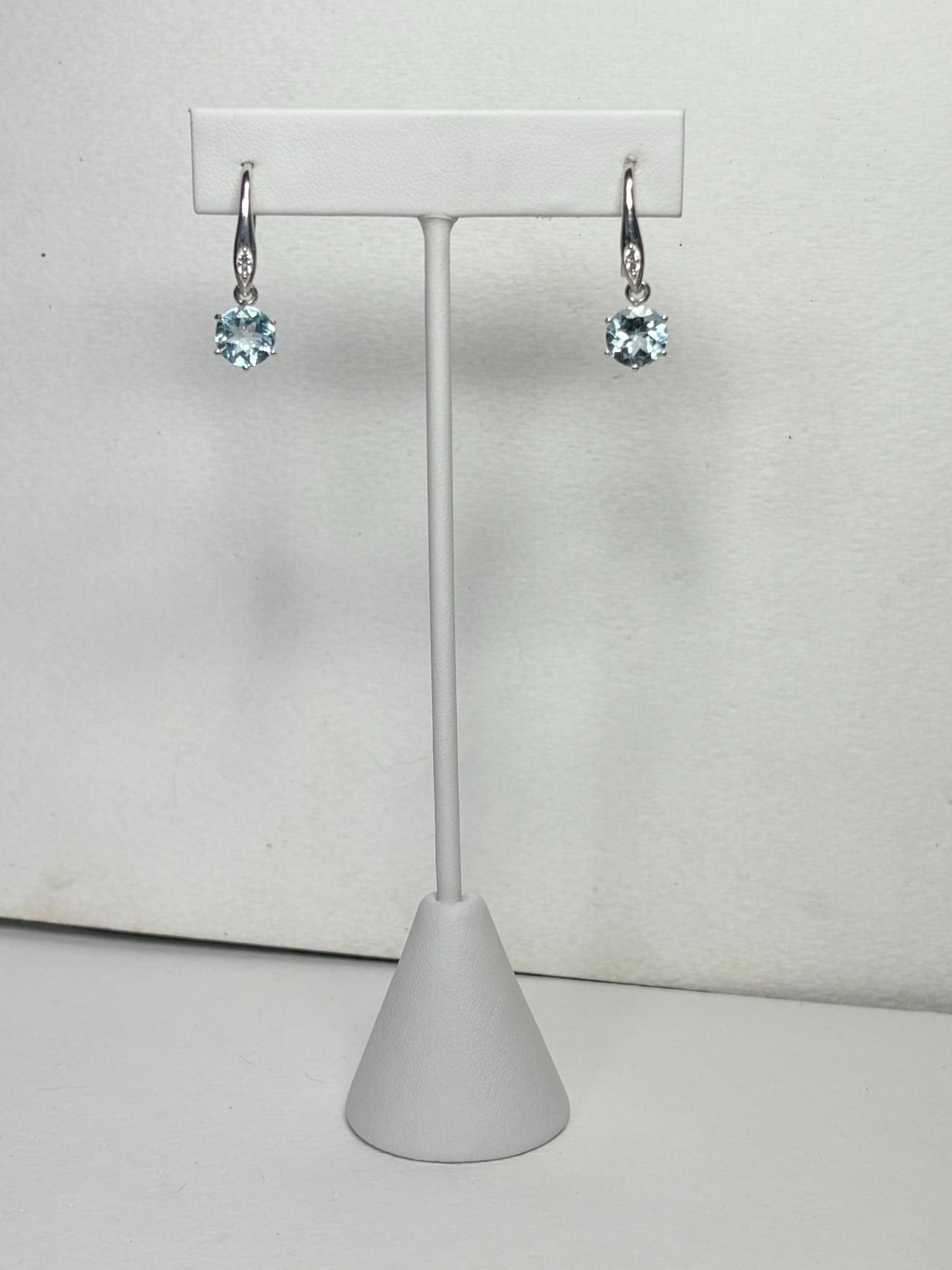 Sterling silver dangle earrings with blue topaz and white zircon.