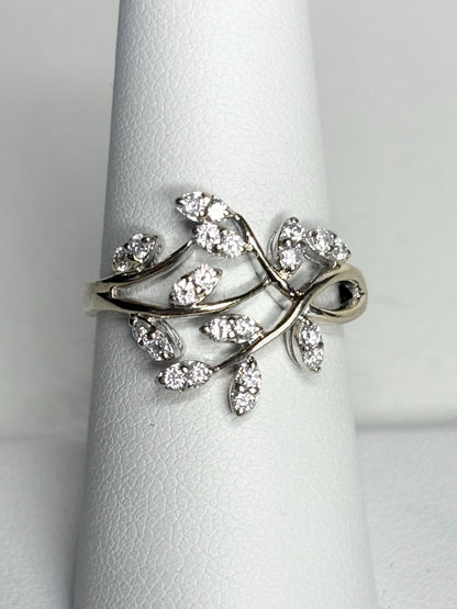A 14k white gold ring with a vine design and approximately 1/2 carat of diamonds.