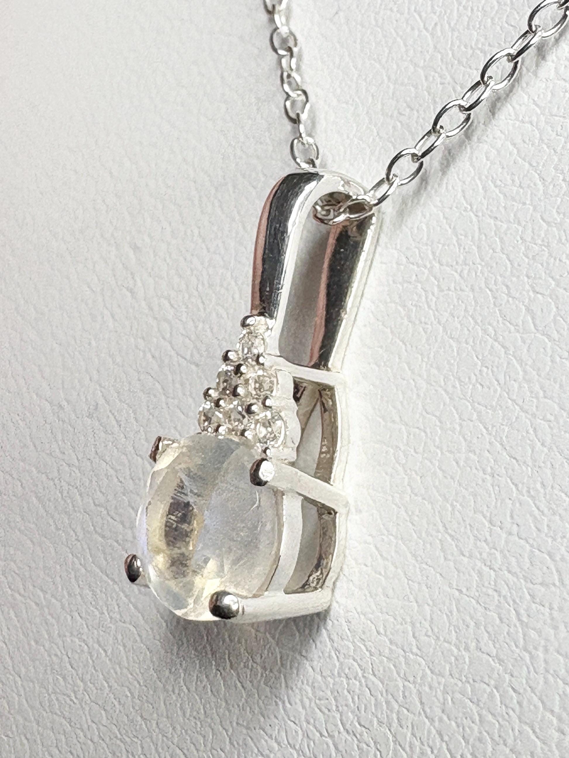 Sterling silver pendant necklace with rainbow moonstone and zircon.