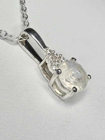 Sterling silver pendant necklace with rainbow moonstone and zircon.