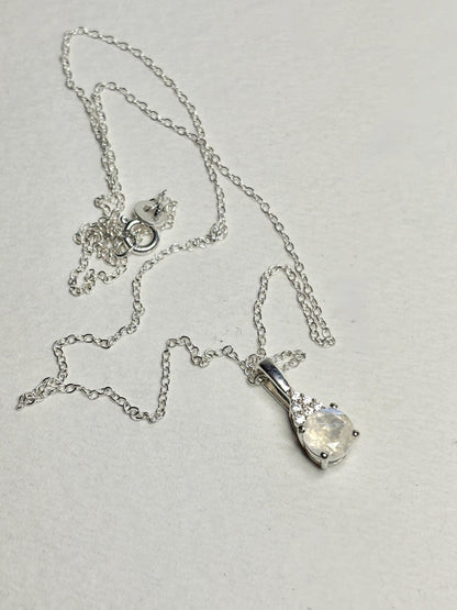 Sterling silver necklace with rainbow moonstone and zircon pendant.