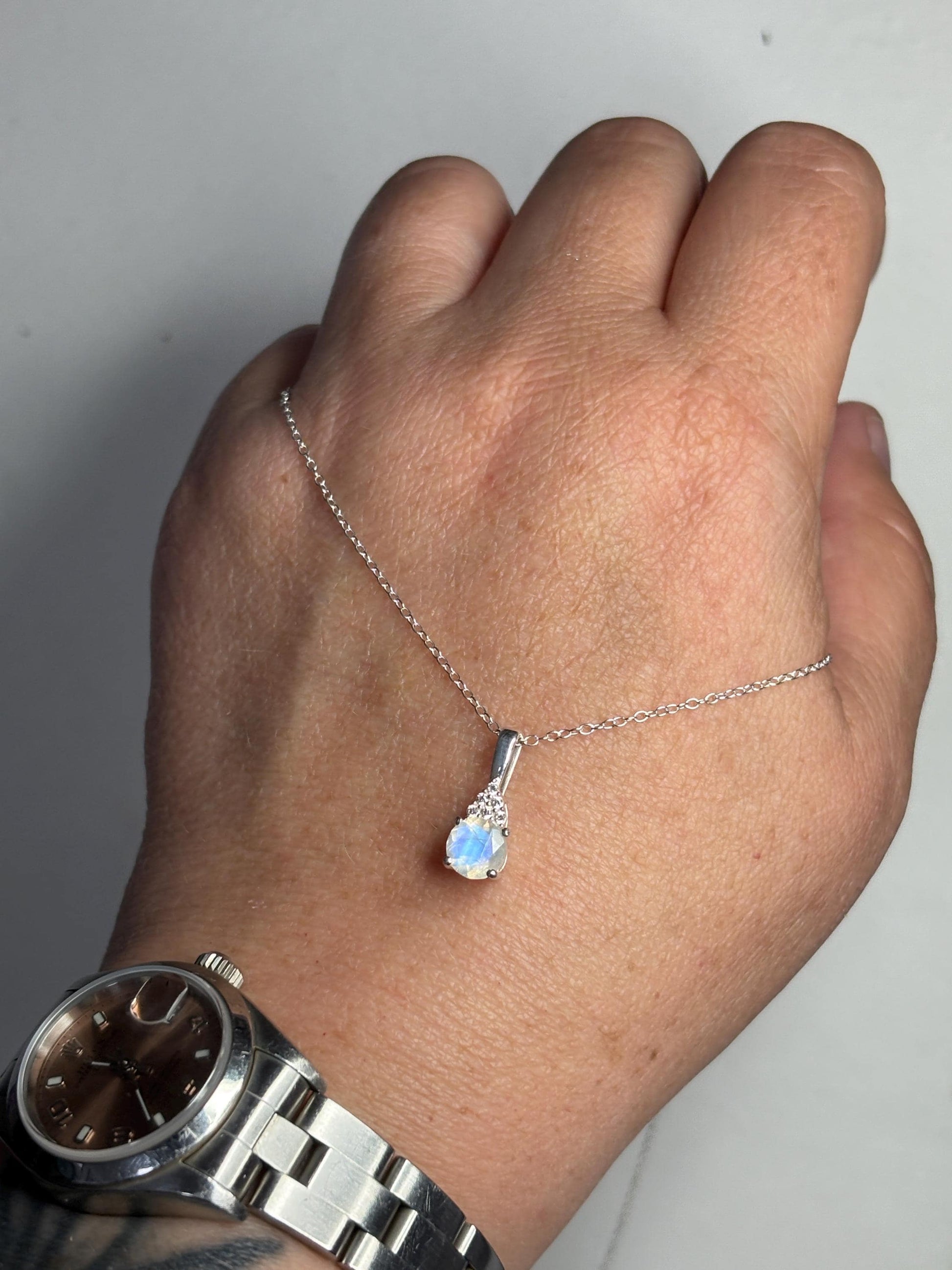 Sterling silver pendant necklace with rainbow moonstone and zircon.