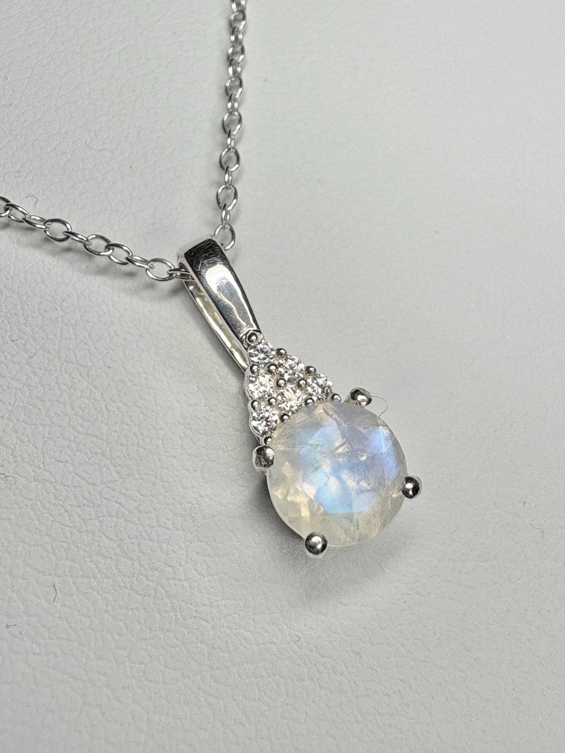 Sterling silver pendant necklace with rainbow moonstone and zircon.
