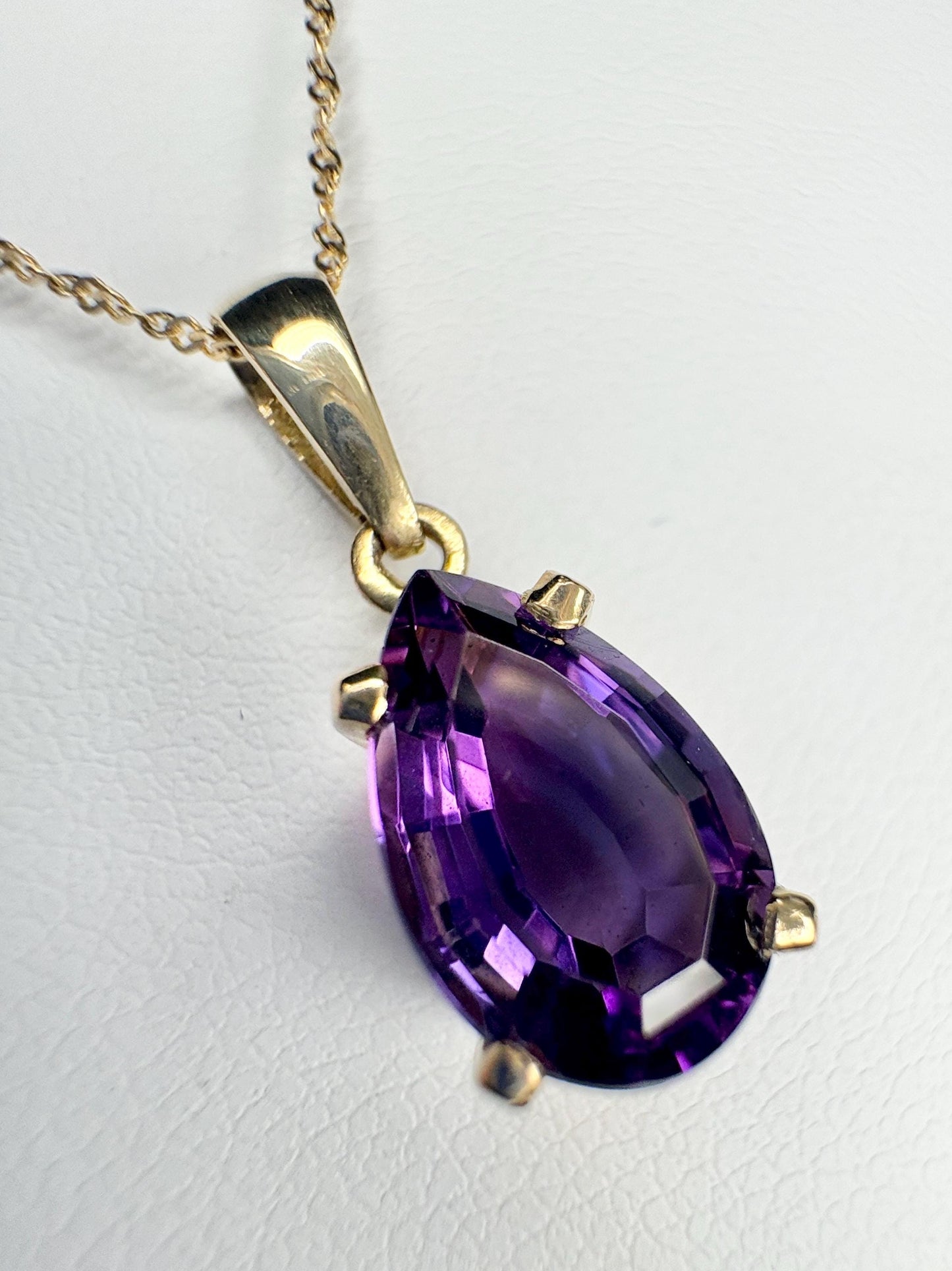 14k gold pendant necklace with a pear-shaped amethyst.