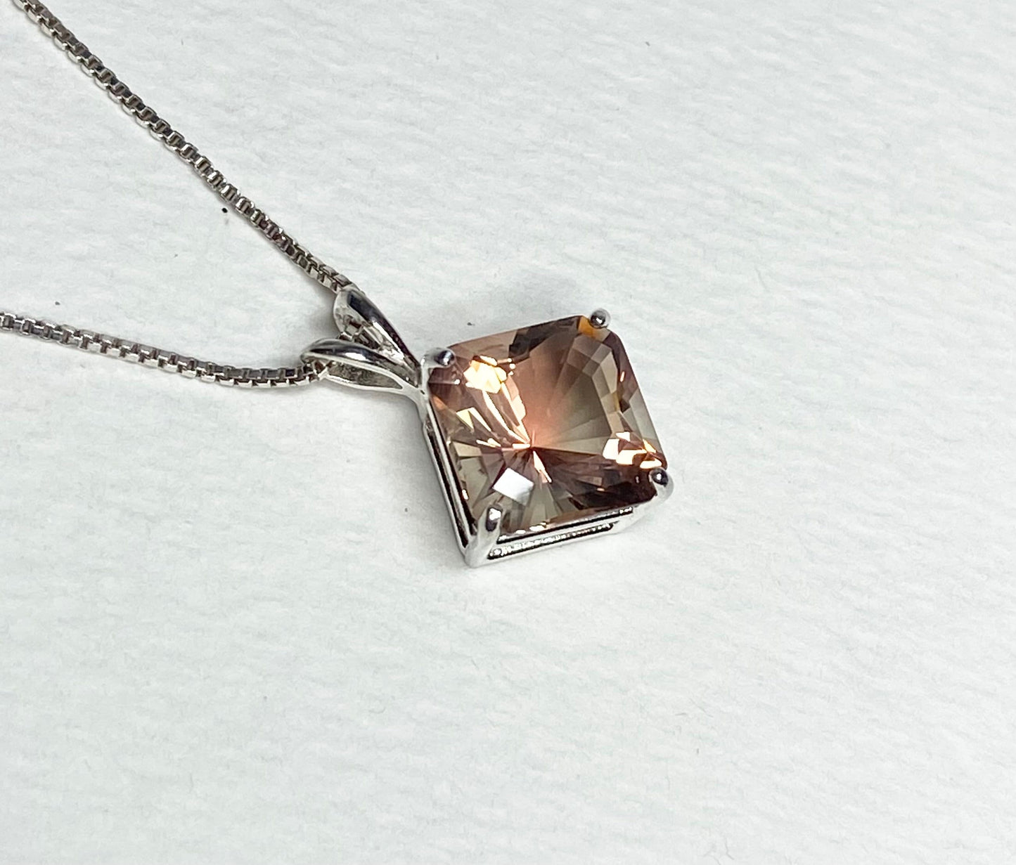 Sterling silver pendant necklace with a large, square-cut Oregon sunstone.