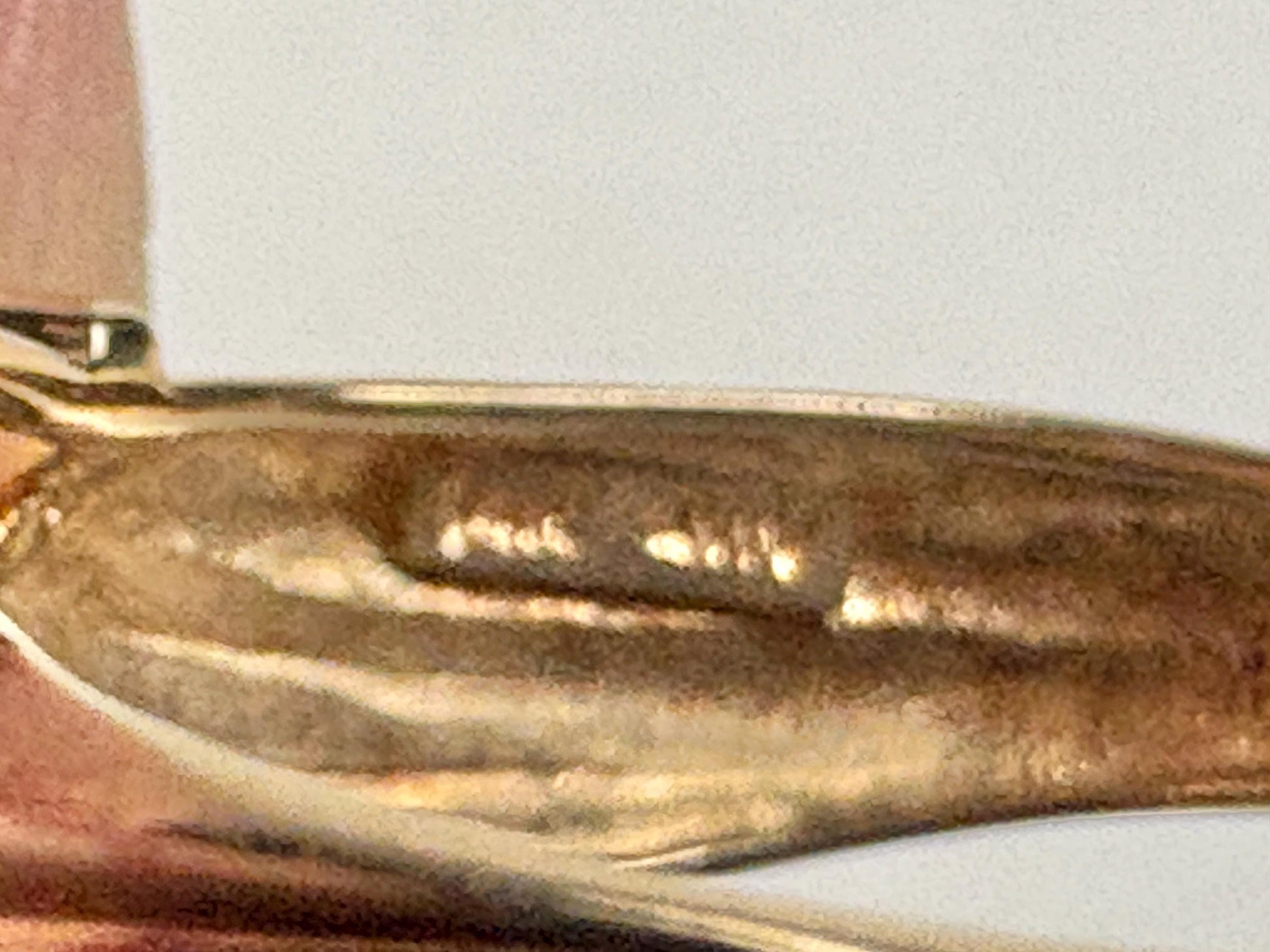 Solid 14k gold ring with a faceted oval moldavite stone.