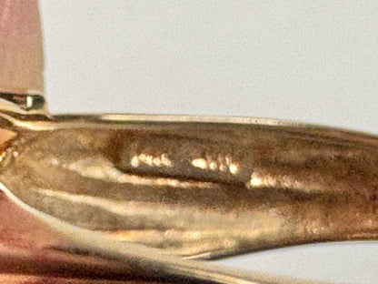 Solid 14k gold ring with a faceted oval moldavite stone.