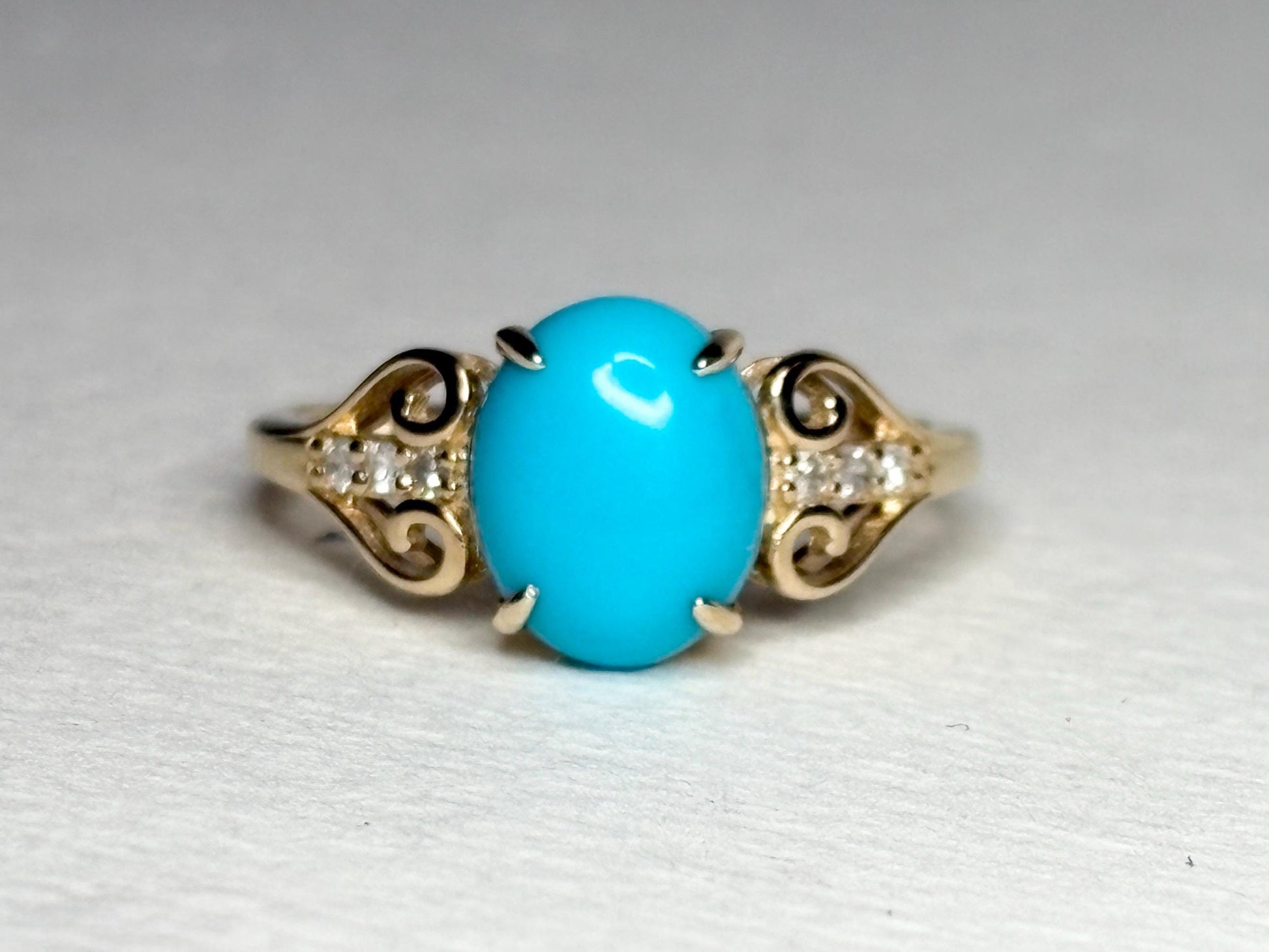 10k gold ring with oval Sleeping Beauty turquoise and accent diamonds.
