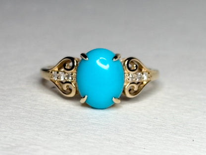 10k gold ring with oval Sleeping Beauty turquoise and accent diamonds.