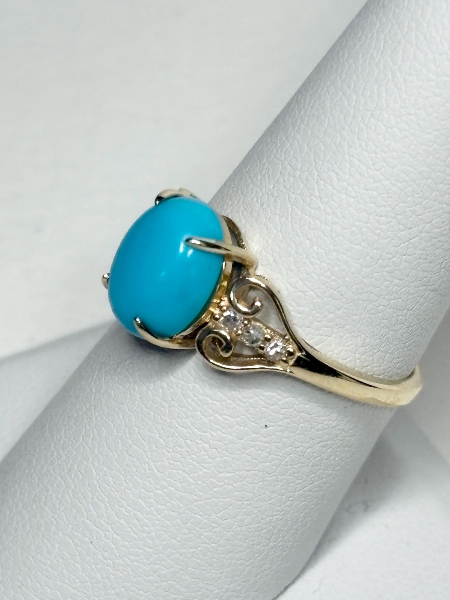 10k gold ring with oval Sleeping Beauty turquoise and diamond accents.
