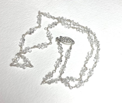 Sterling silver necklace with double terminated quartz crystals and a filigree clasp.