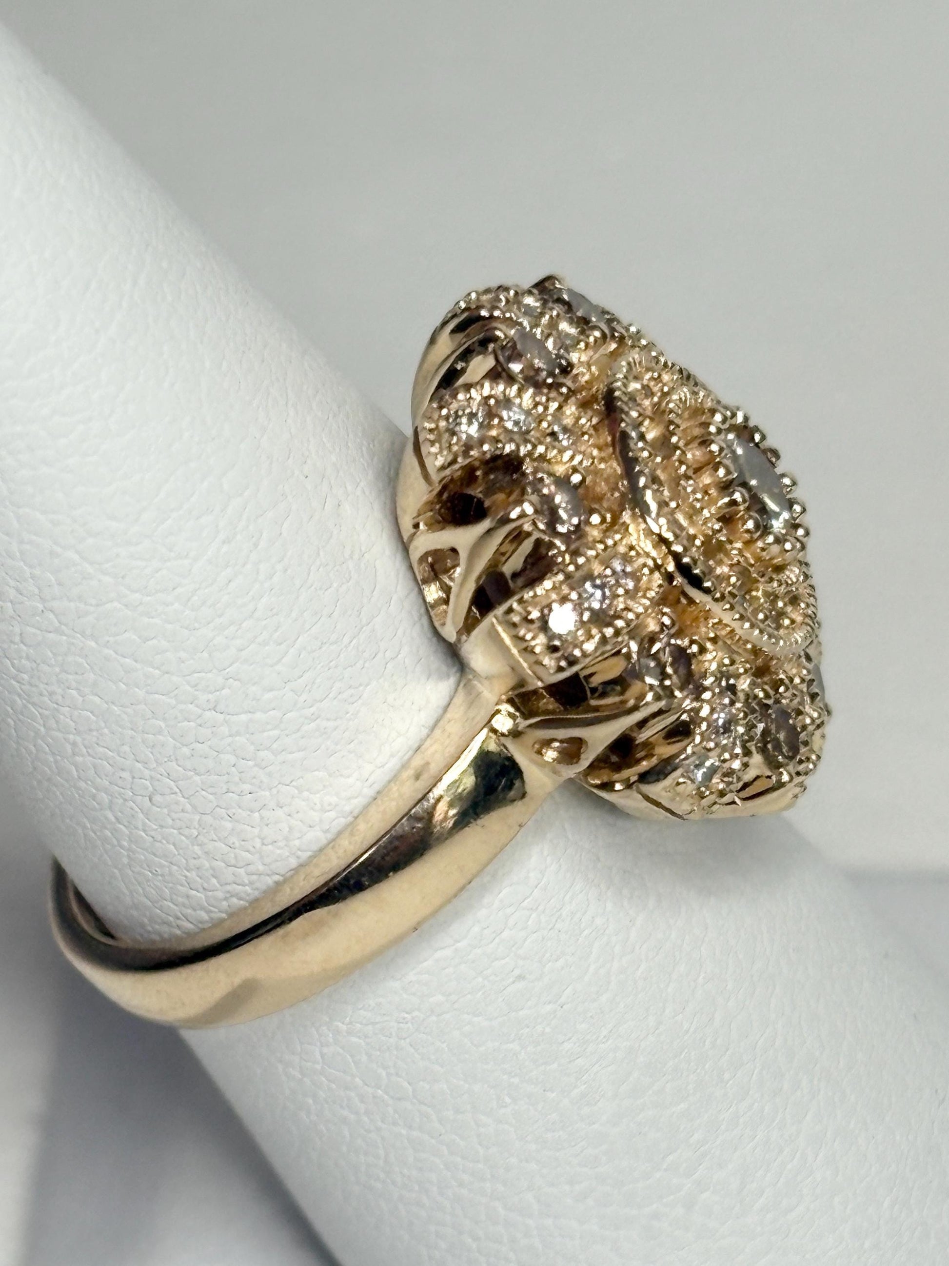Bold 14k gold ring with champagne diamonds in a sunburst design.