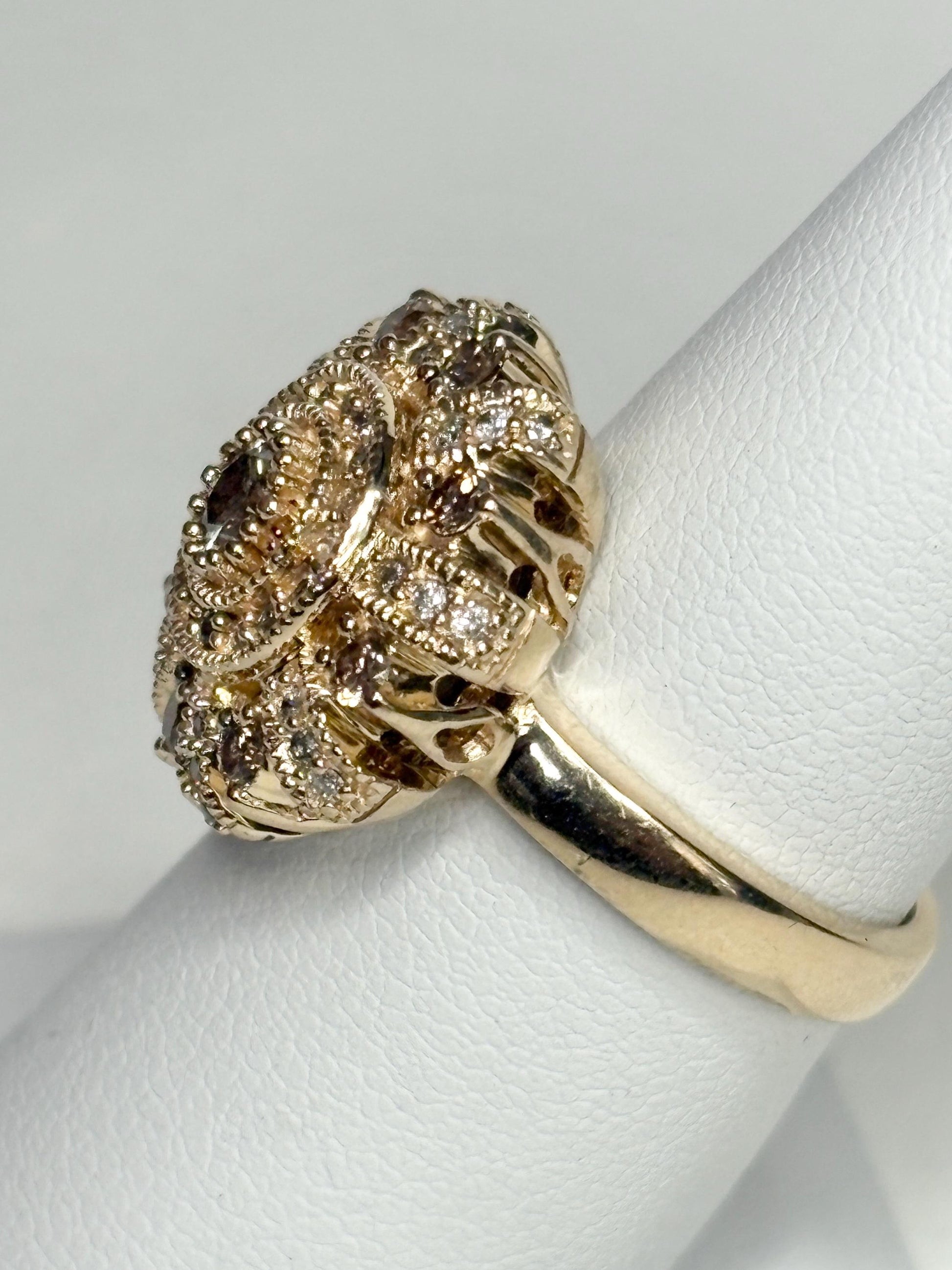 Bold 14k gold ring with champagne diamonds in a sunburst design.