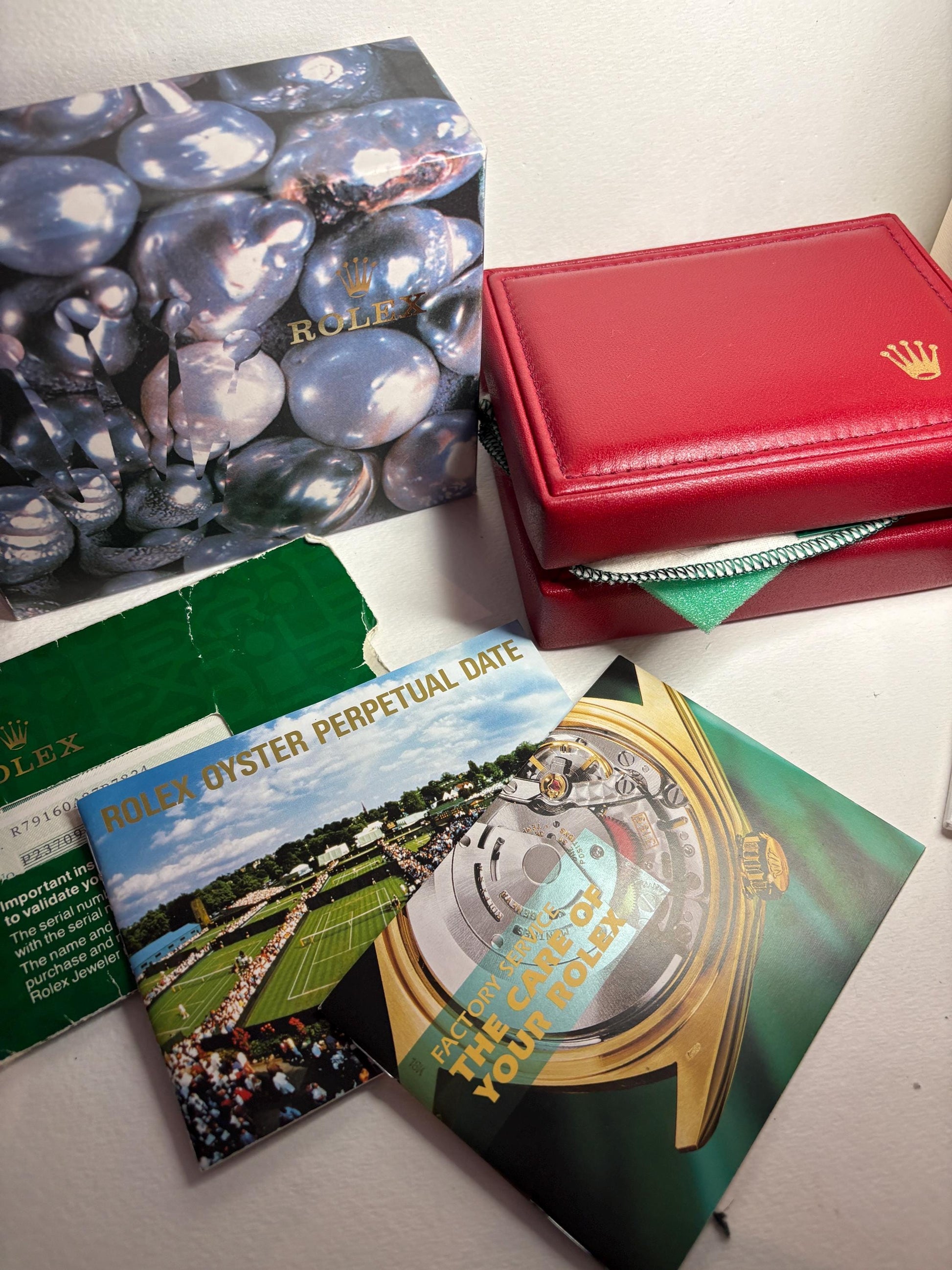 Rolex Oyster Perpetual watch with box and papers.
