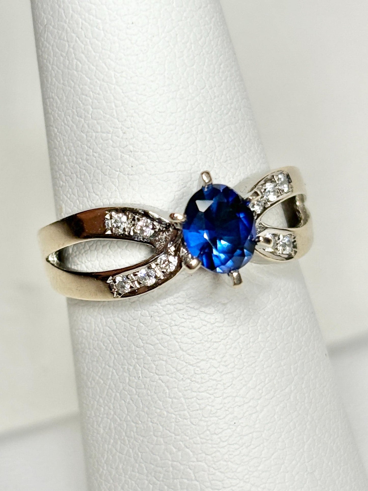 A vivid blue sapphire and diamond ring in 18k white gold.