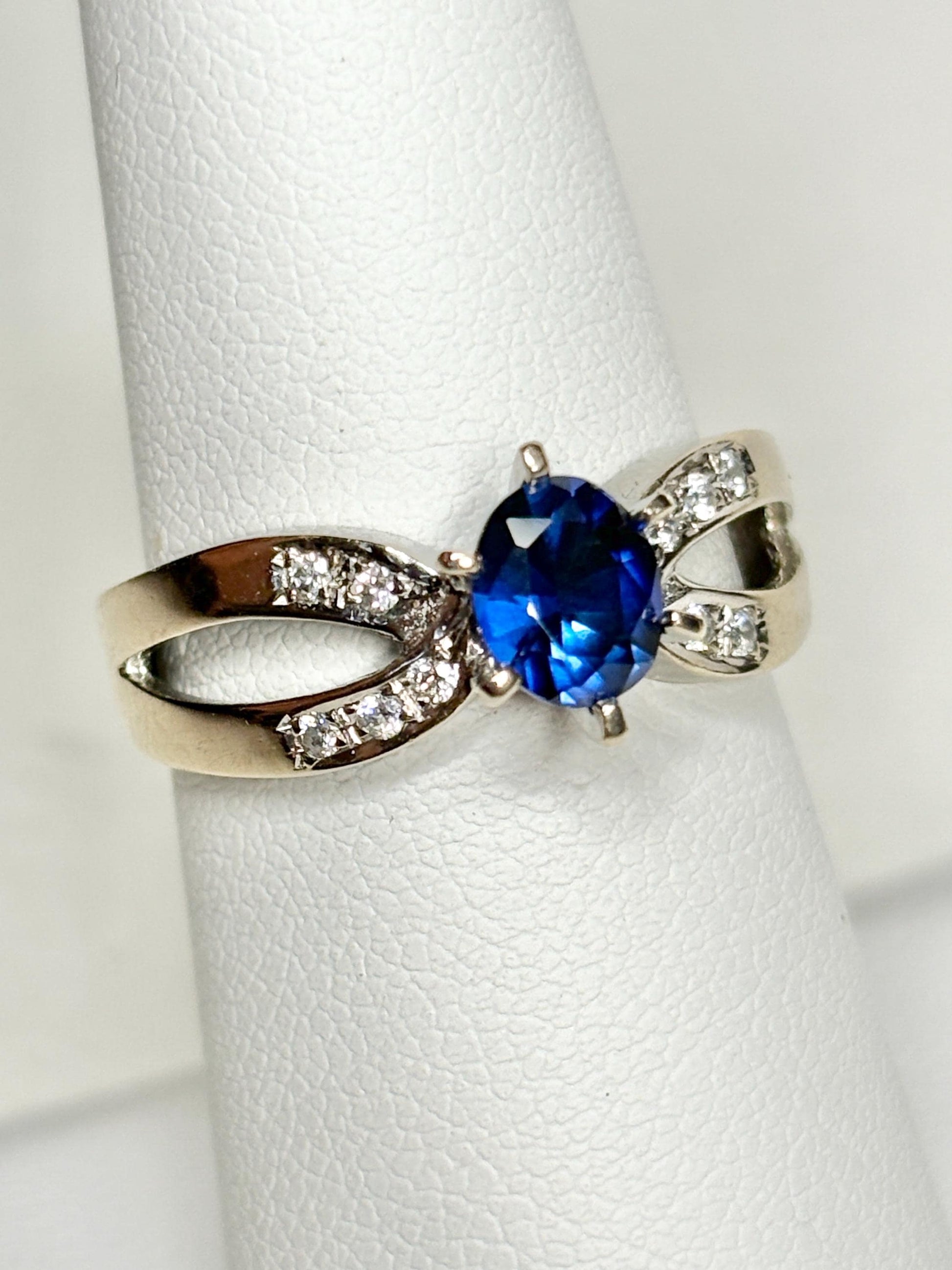 A vivid blue sapphire and diamond ring in 18k white gold.