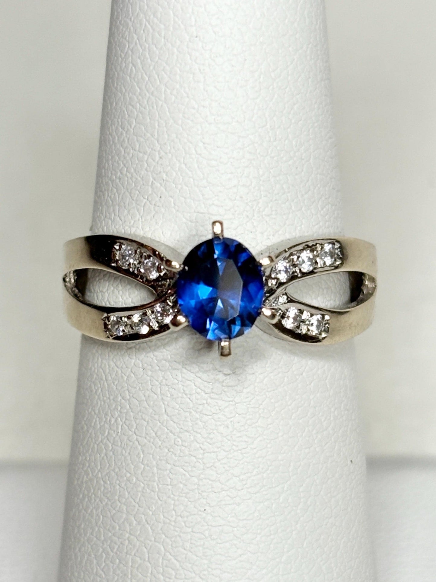 18k white gold ring with a vivid blue sapphire and diamonds.