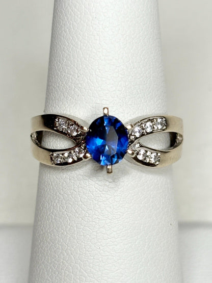 18k white gold ring with a vivid blue sapphire and diamonds.