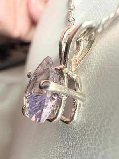 Sterling silver pendant necklace with a trillion cut kunzite gemstone.