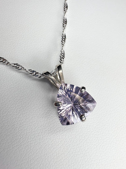 Sterling silver necklace with a trillion-cut kunzite pendant.
