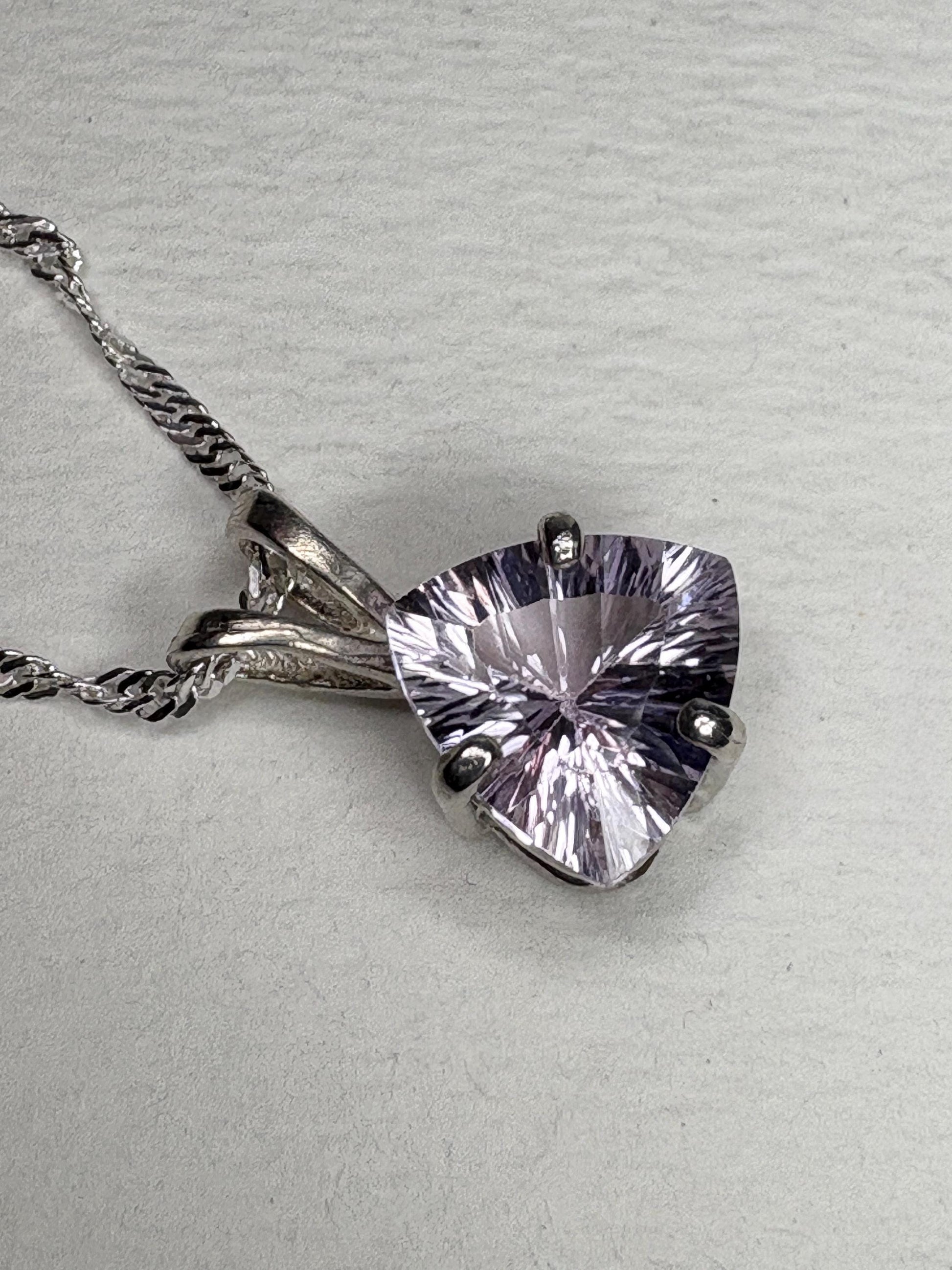 Sterling silver pendant necklace with a light lilac trillion kunzite gemstone.