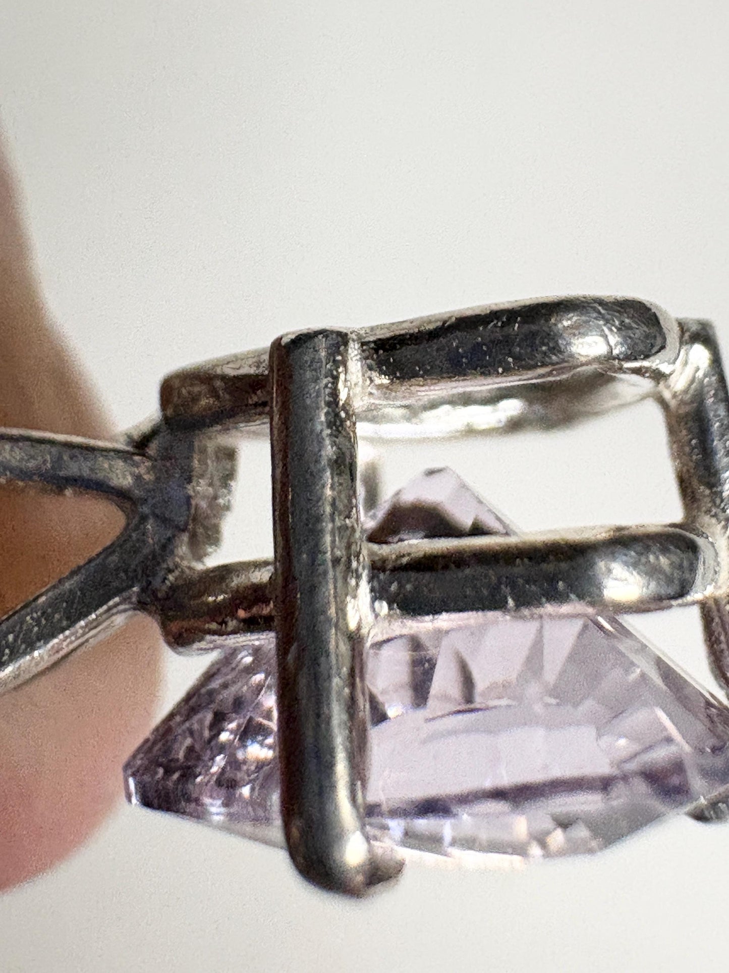 Sterling silver pendant necklace featuring a light lilac trillion cut kunzite stone.