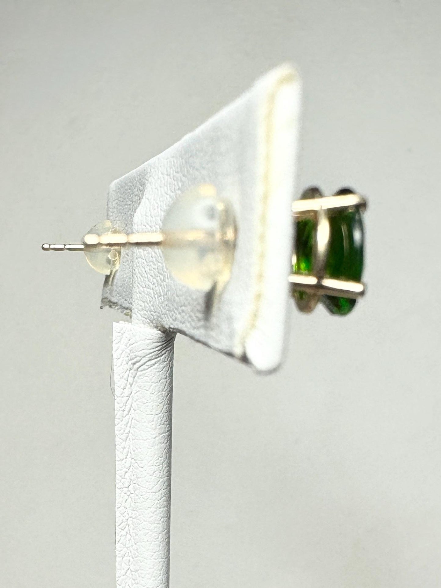 14k gold stud earrings with oval chrome diopside stones.