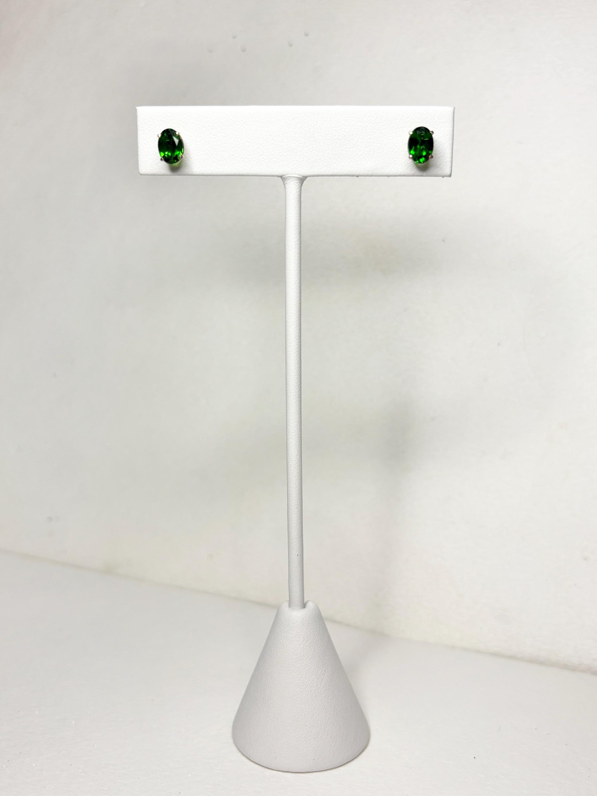 Oval chrome diopside stud earrings in 14k gold.