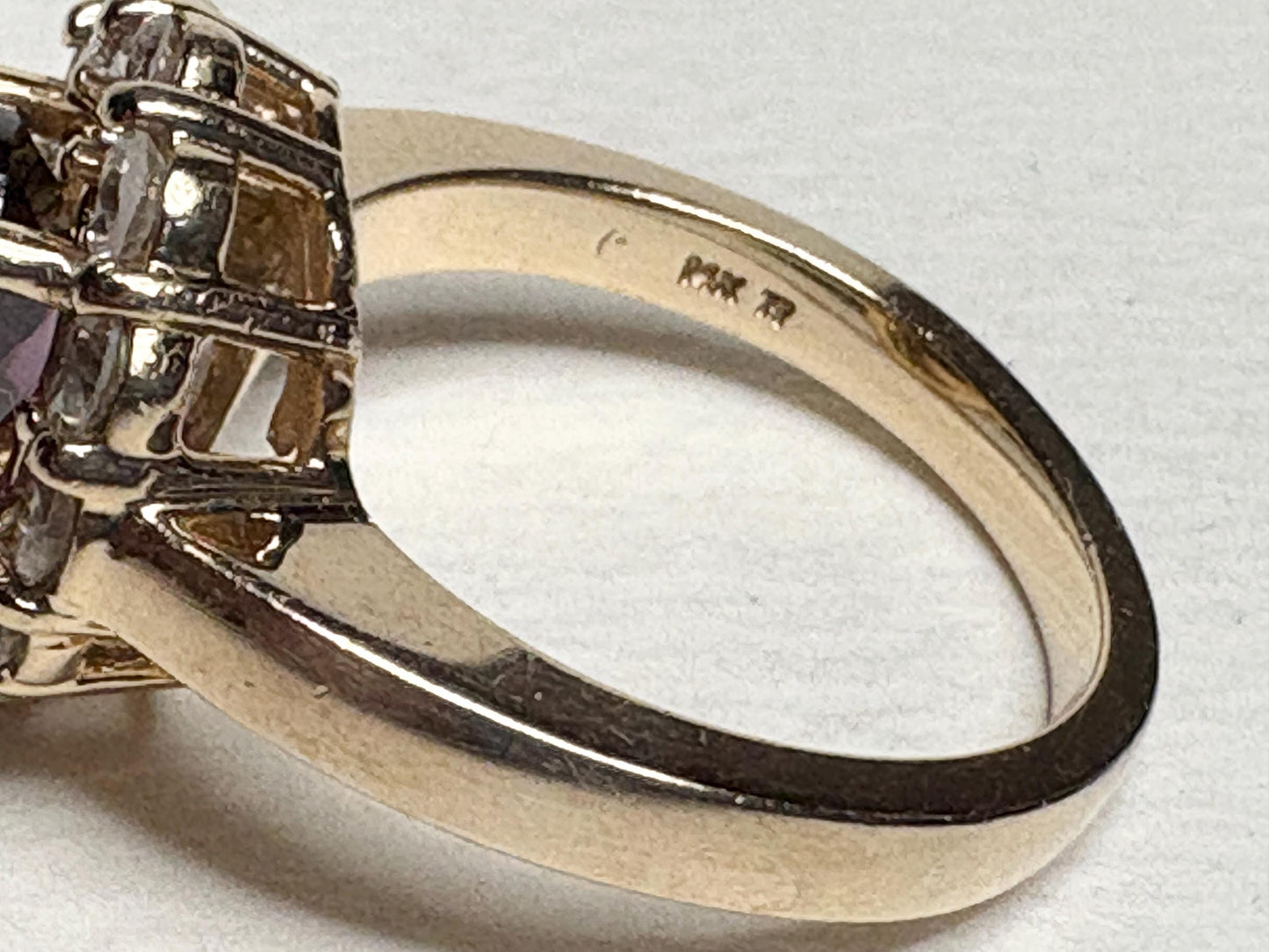 14k yellow gold ring with checkerboard faceted rhodolite garnet and diamonds.