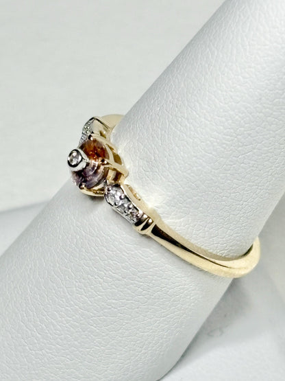 A 9k gold ring with a bi-color Montana sapphire and diamonds.