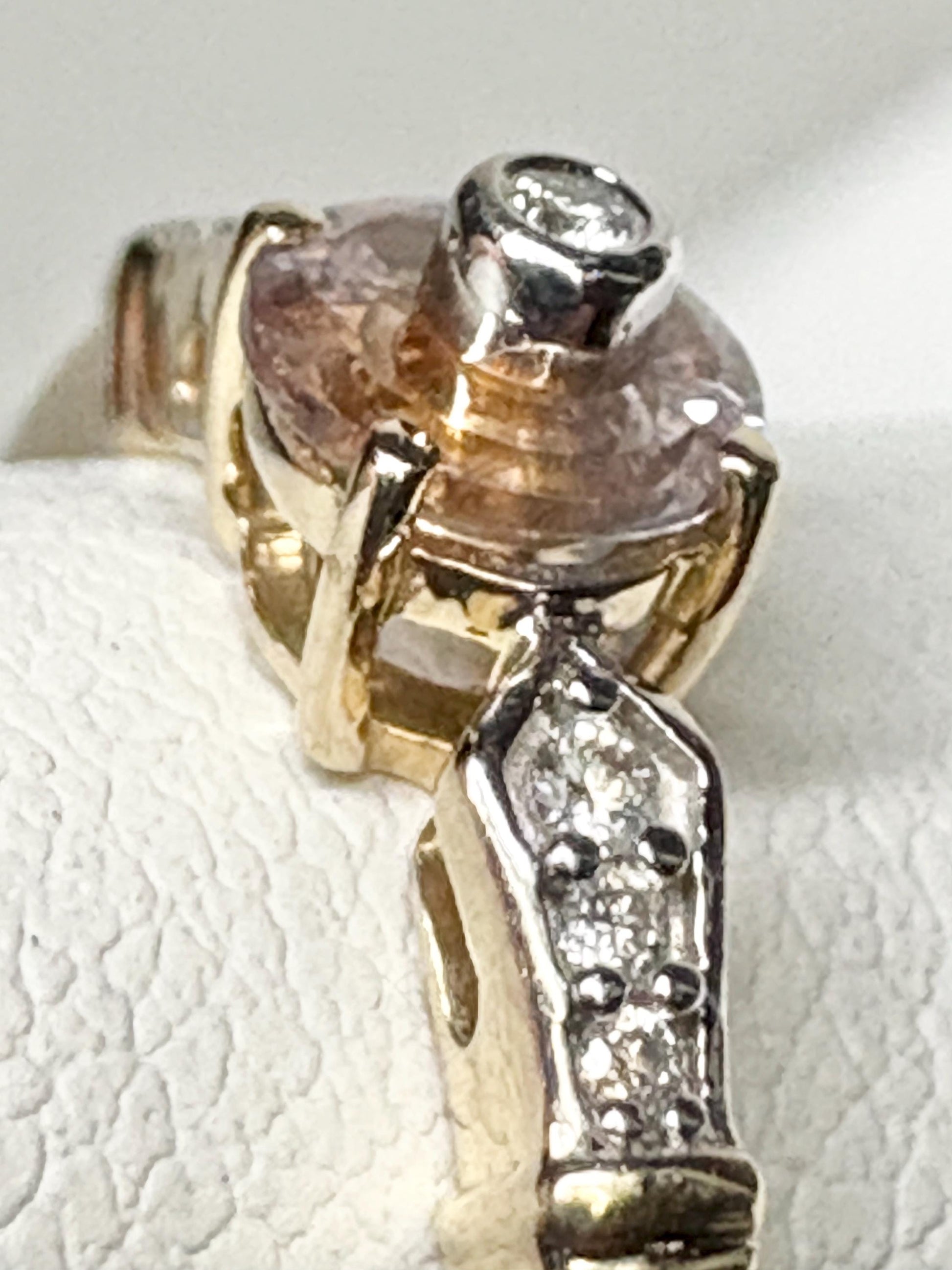 A 9k gold ring with a bi-color Montana sapphire and diamonds.