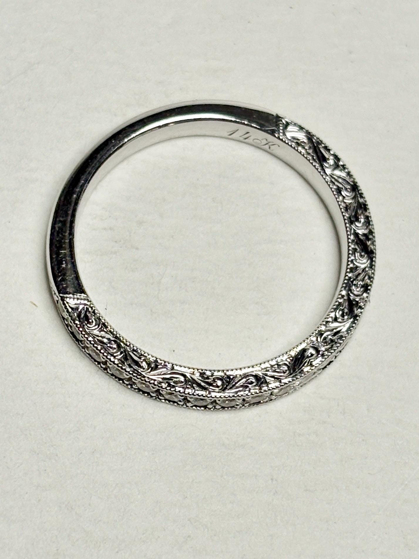 14k white gold stackable band ring with intricate detailing and diamonds.
