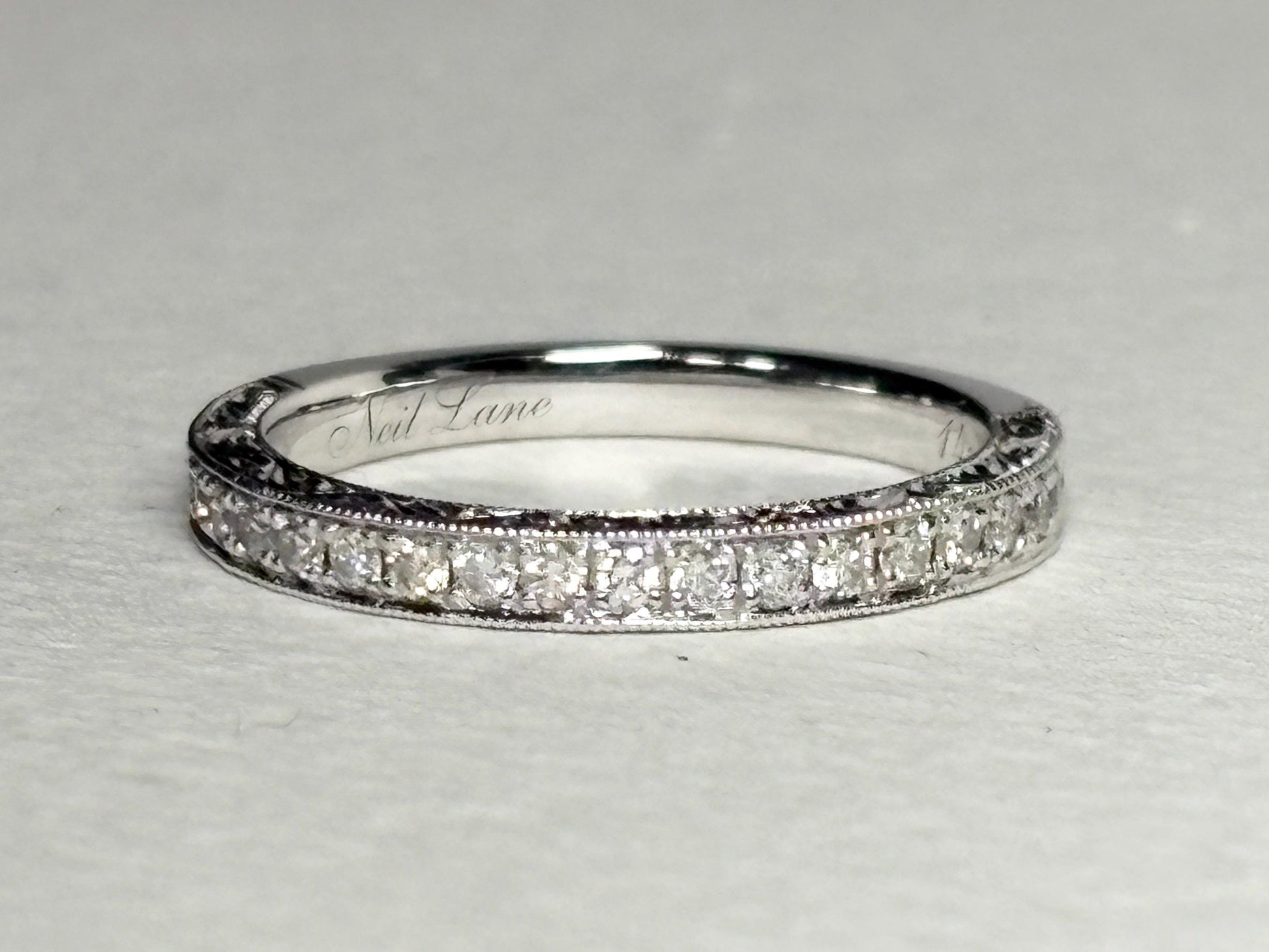 Neil Lane 14k white gold band with diamonds and intricate detailing.