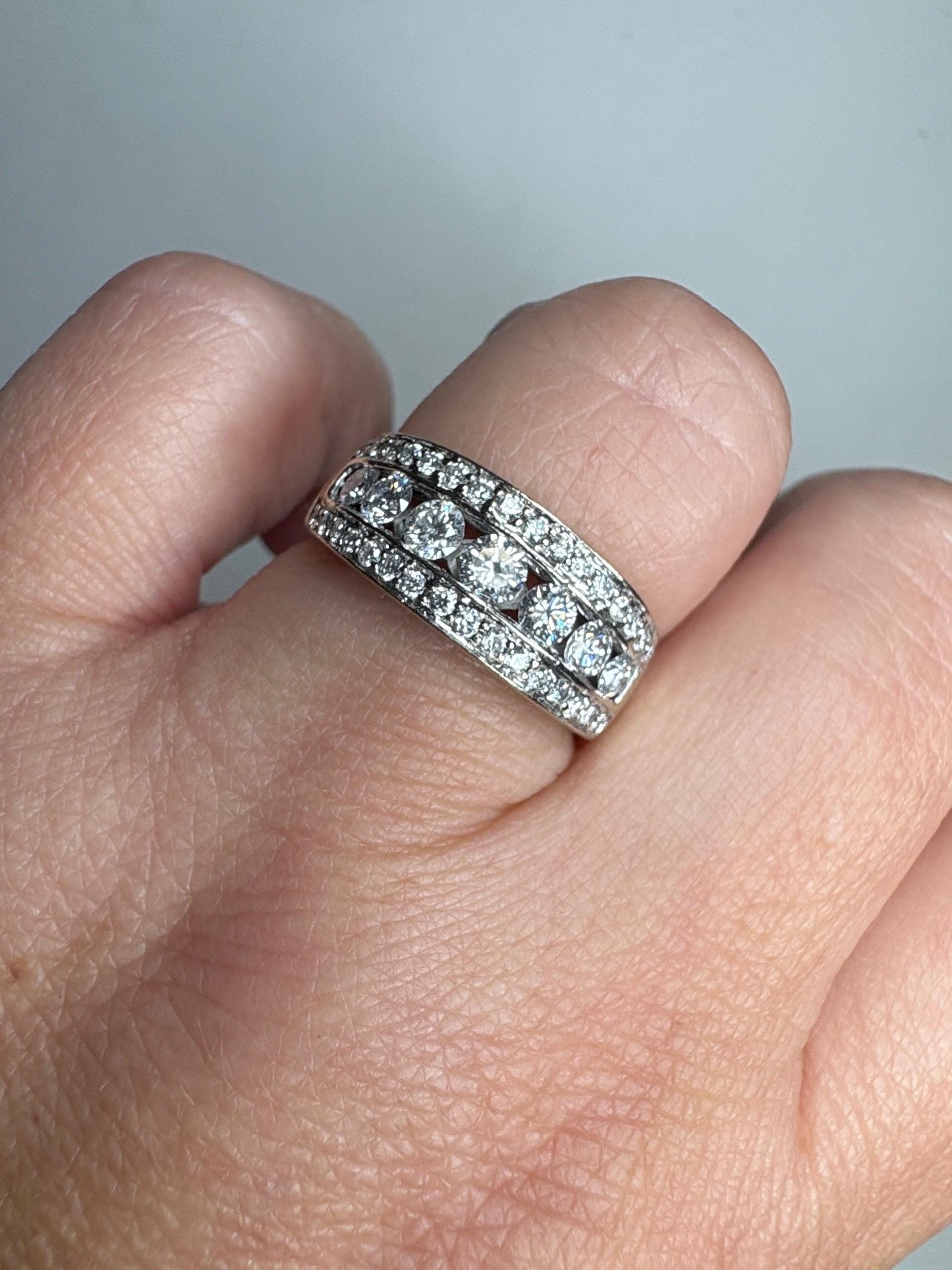 14k white gold anniversary band ring with channel and pave set diamonds.