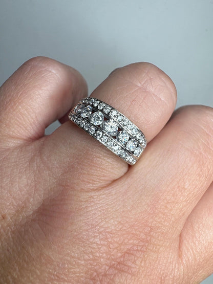 14k white gold anniversary band ring with channel and pave set diamonds.