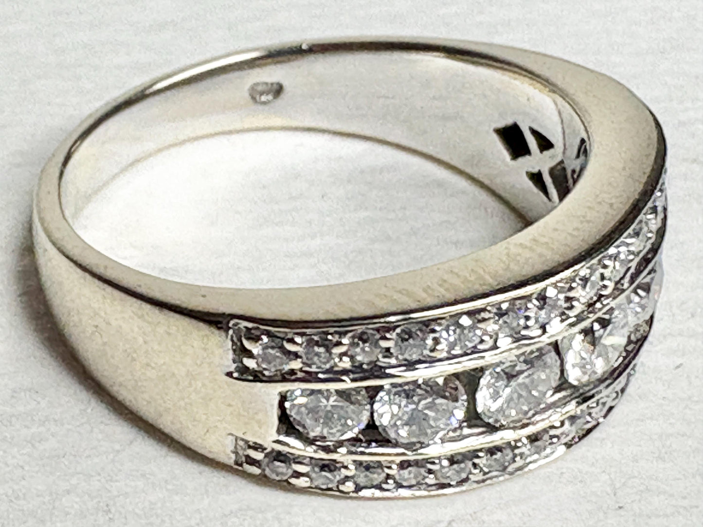 14k white gold anniversary band ring with pave and channel set diamonds.