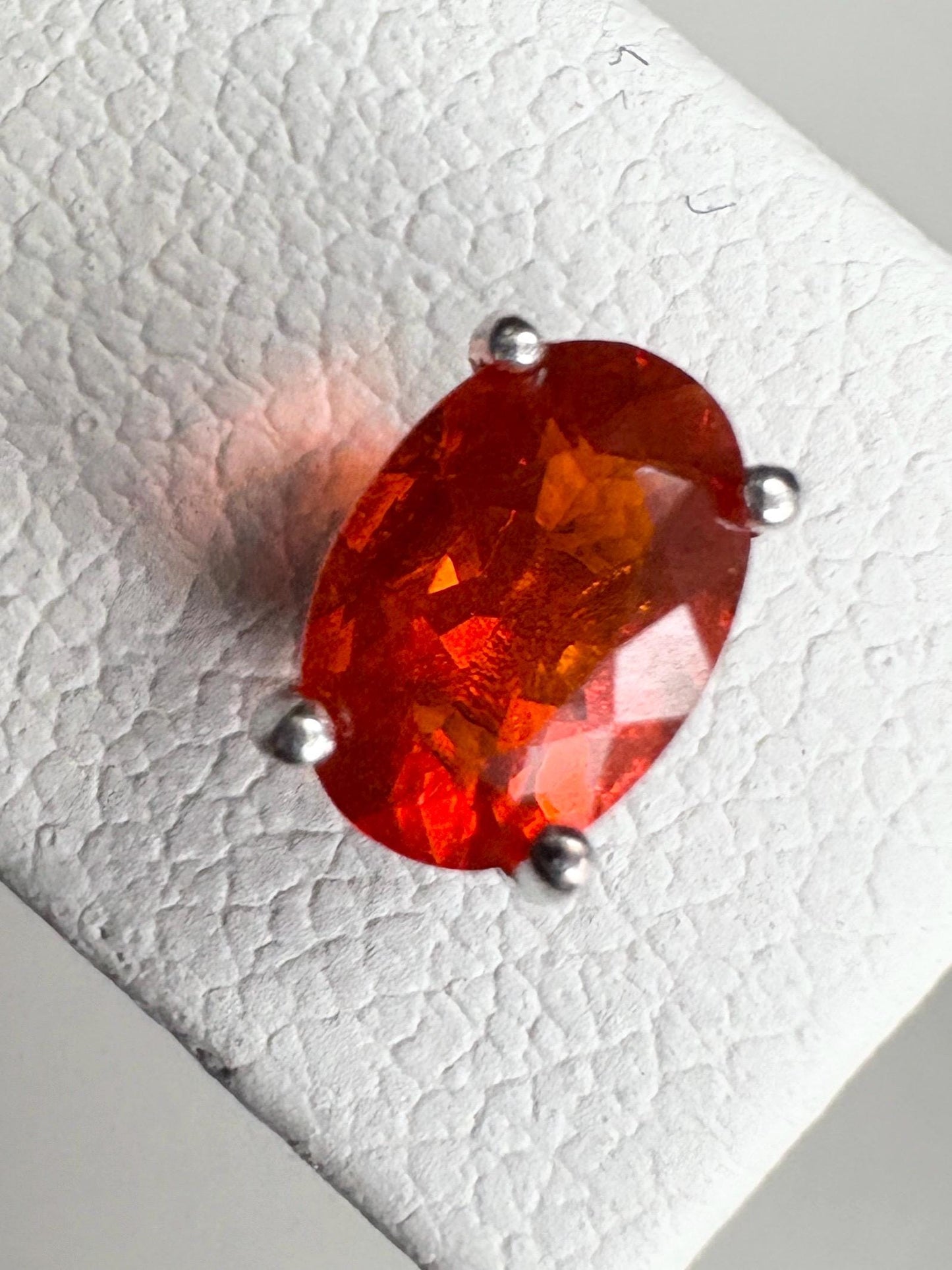 Oval Mexican fire opal solitaire stud earrings in sterling silver.