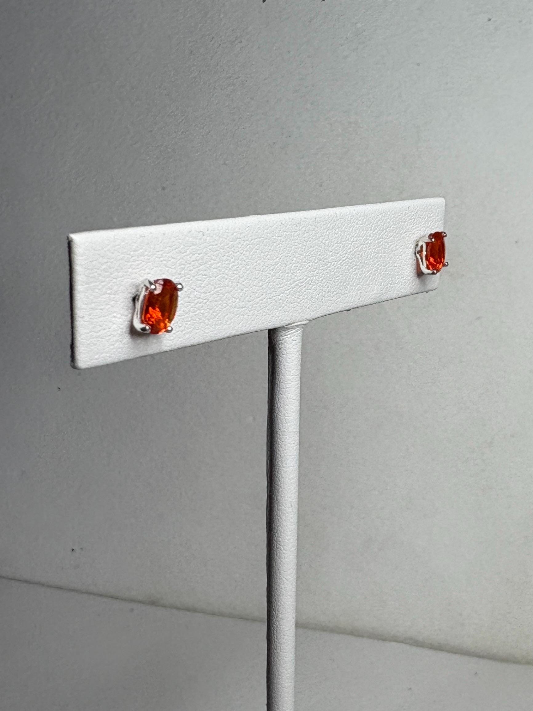 Sterling silver stud earrings with 6x4mm oval Mexican fire opals.