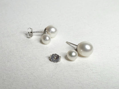 Sterling silver earrings with freshwater cultured pearls in a dangle drop design.