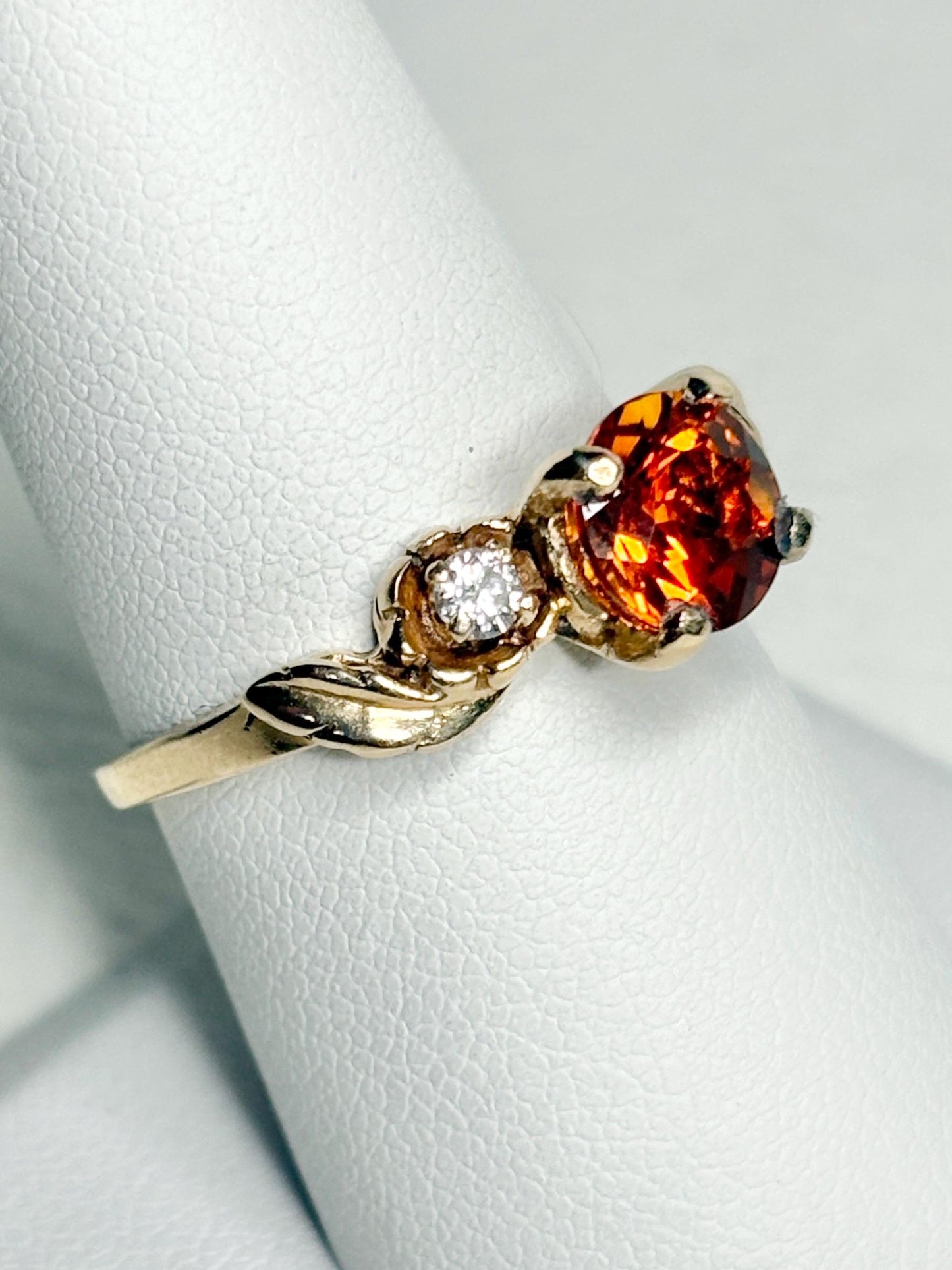 14k gold ring with Madeira citrine and diamonds in a floral design.