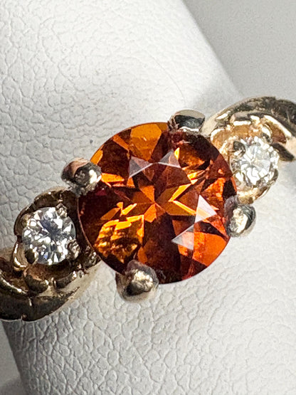 14k gold ring with a Madeira citrine and two diamonds in a floral design.