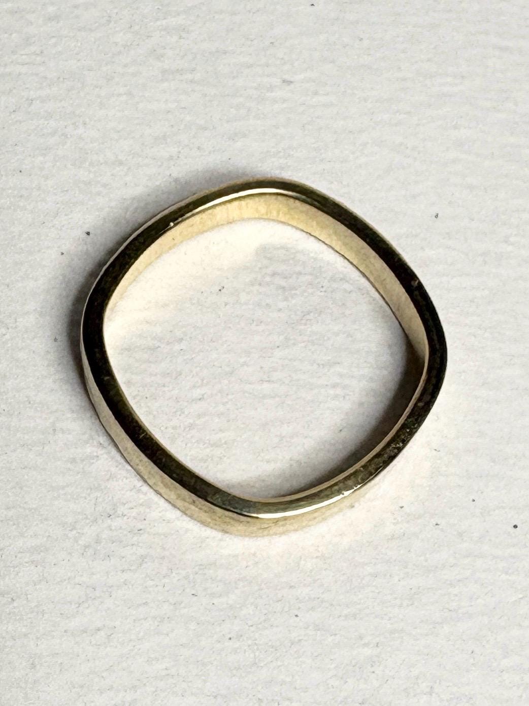 Solid 18k yellow gold square band ring with a hammered finish.