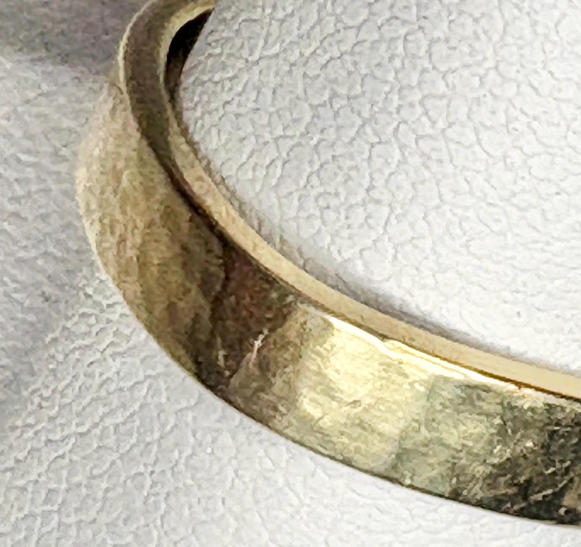 Solid 18k yellow gold hammered finish square band ring.