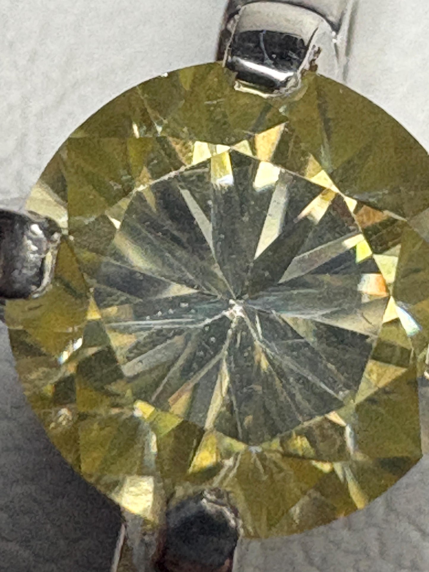 Yellow moissanite solitaire ring in sterling silver.