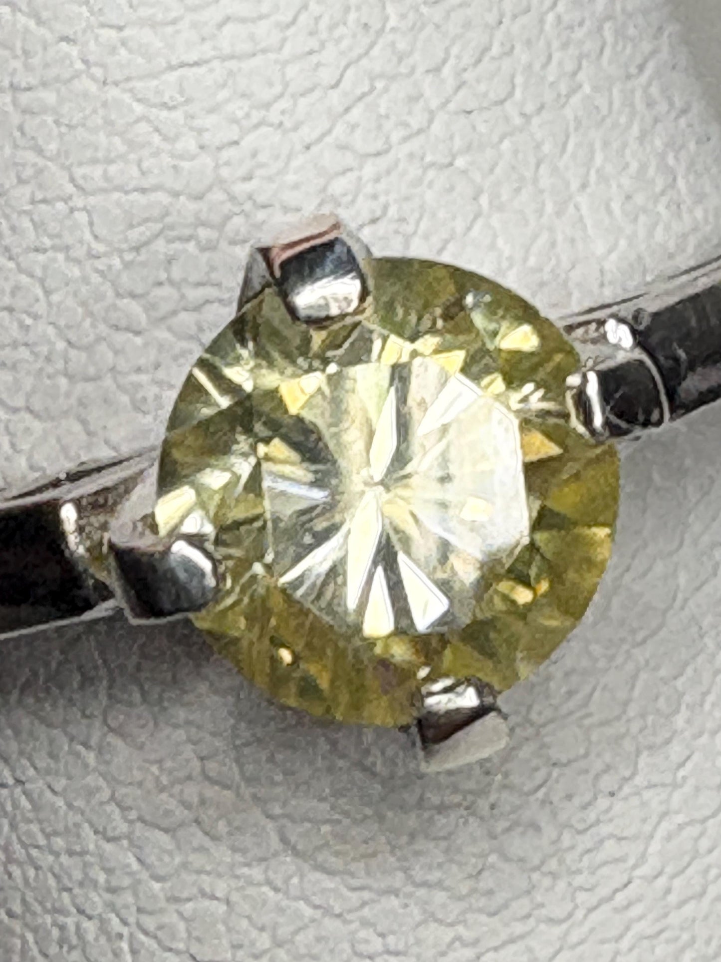 Yellow moissanite solitaire ring in sterling silver.