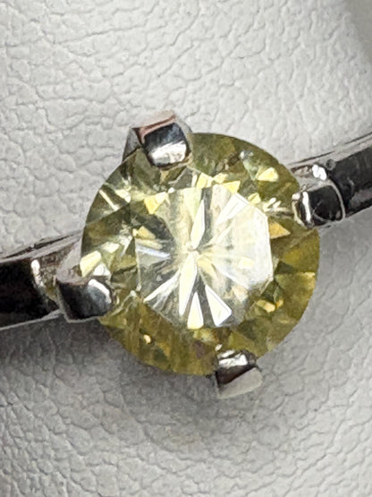 Yellow moissanite solitaire ring in sterling silver.