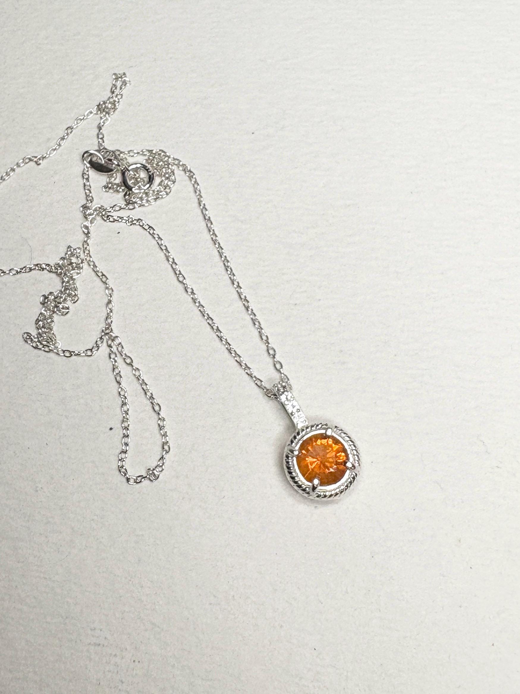 Sterling silver necklace with an orange fire opal and white topaz pendant.