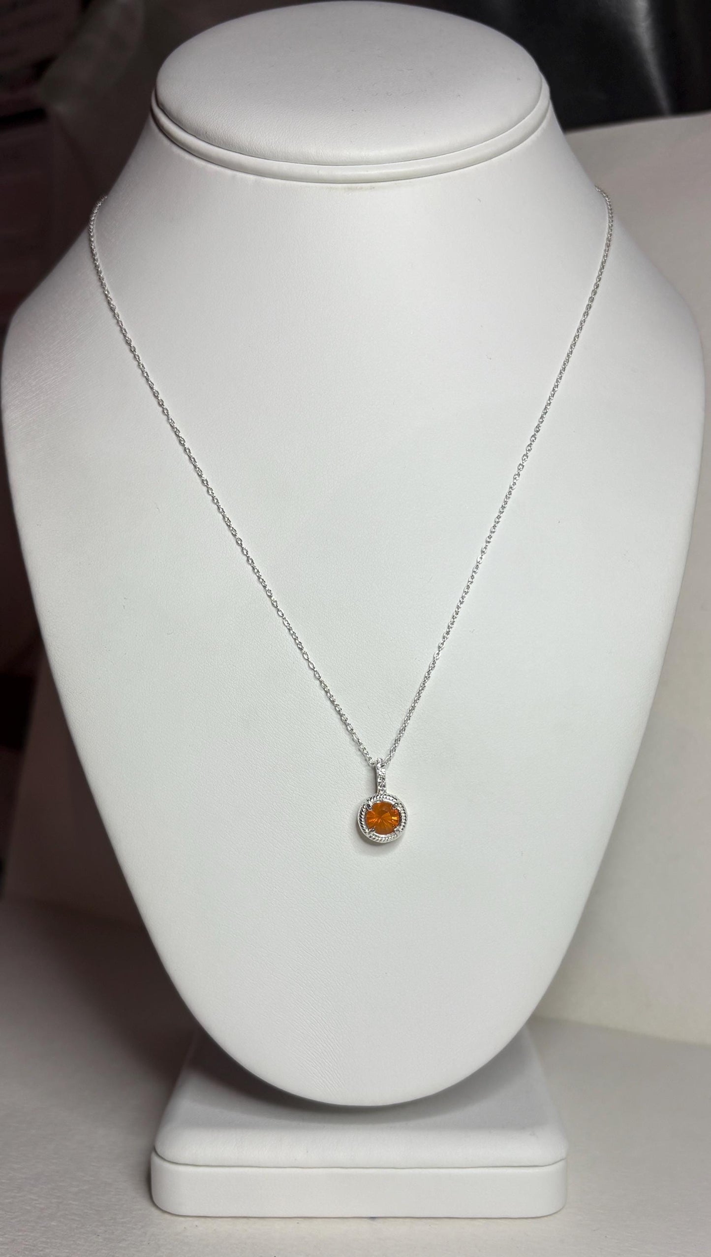 Sterling silver necklace with a round Oregon fire opal pendant and white topaz accents.